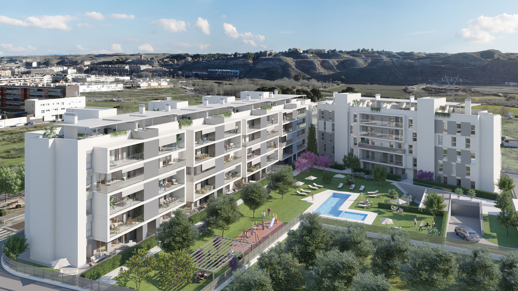 Vista aérea diurna del residencial Monteverde en Cuarte de Huerva con piscina, jardín y montañas de Zaragoza