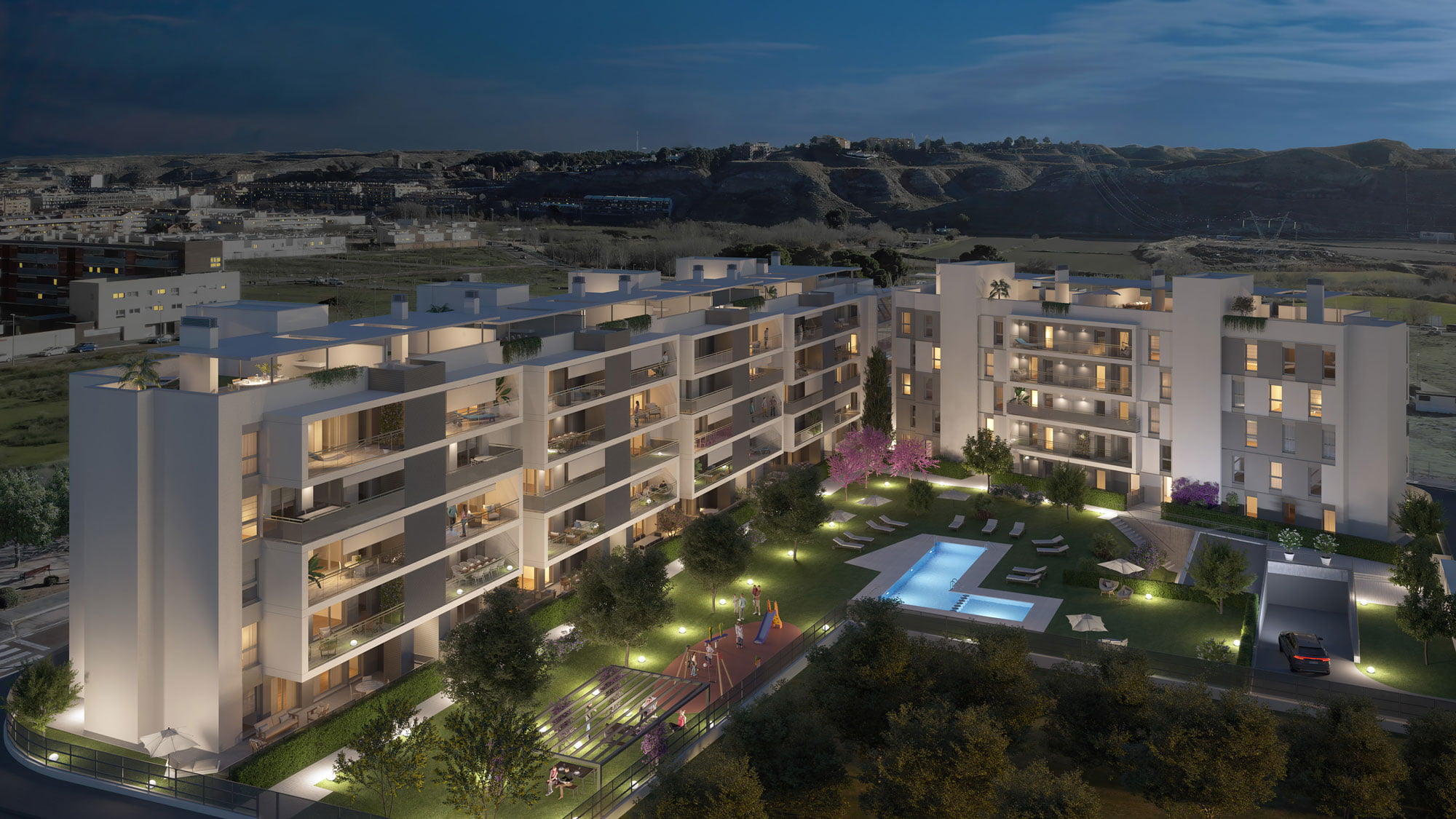Infografía nocturna del conjunto residencial Monteverde iluminado con piscina y zonas ajardinadas